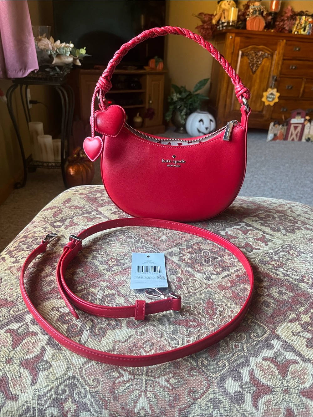 kate spade red braided-handle crescent bag with heart charms